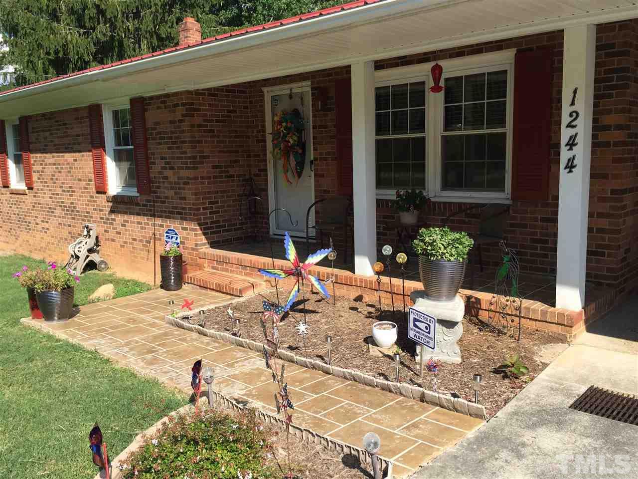 1244 Ridge Road Roxboro, NC 27573 - Photo 18 of 22 a view of a house with backyard and sitting area