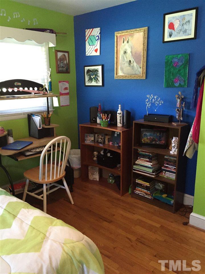1244 Ridge Road Roxboro, NC 27573 - Photo 21 of 22 a bedroom with furniture and wooden floor
