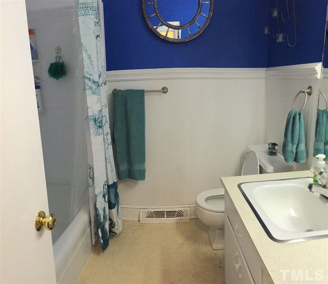 1244 Ridge Road Roxboro, NC 27573 - Photo 10 of 22 a bathroom with a toilet and a sink