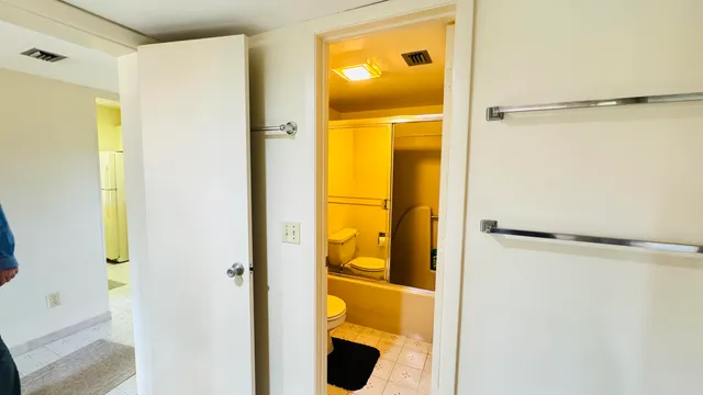 a bathroom with a glass shower door
