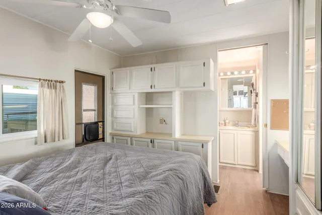 a kitchen with white cabinets and appliances