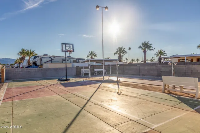 a view of a swimming pool with outdoor seating