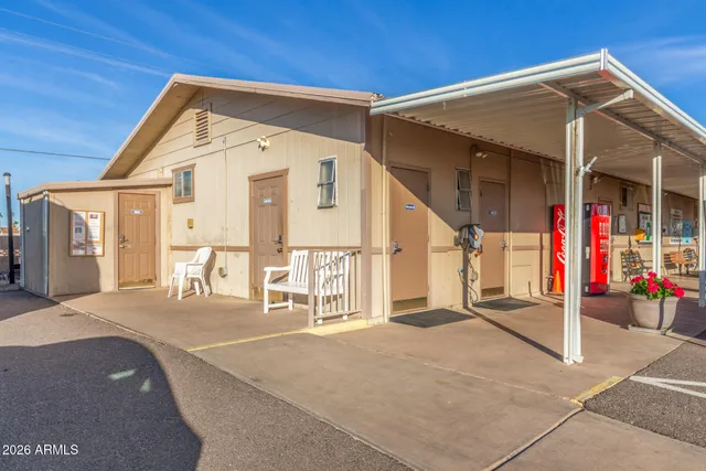 a view of a living room with furniture and flowers
