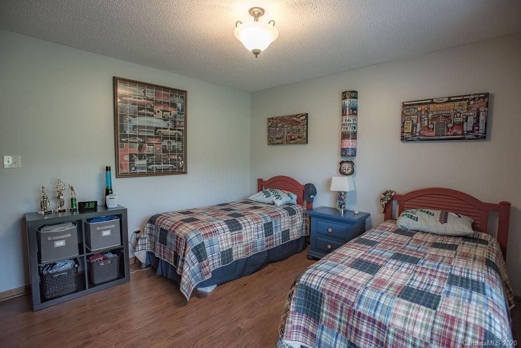 3316 Griffith Road Monroe, NC 28112 - Photo 14 of 28 a bedroom with two beds and a dresser
