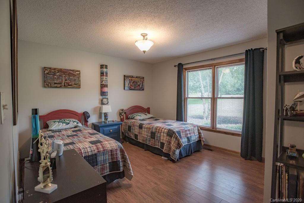 3316 Griffith Road Monroe, NC 28112 - Photo 15 of 28 a bedroom with two beds and a window