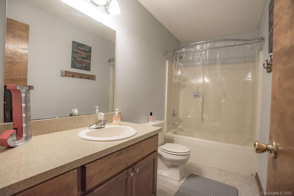 3316 Griffith Road Monroe, NC 28112 - Photo 25 of 28 a bathroom with a sink a toilet and shower