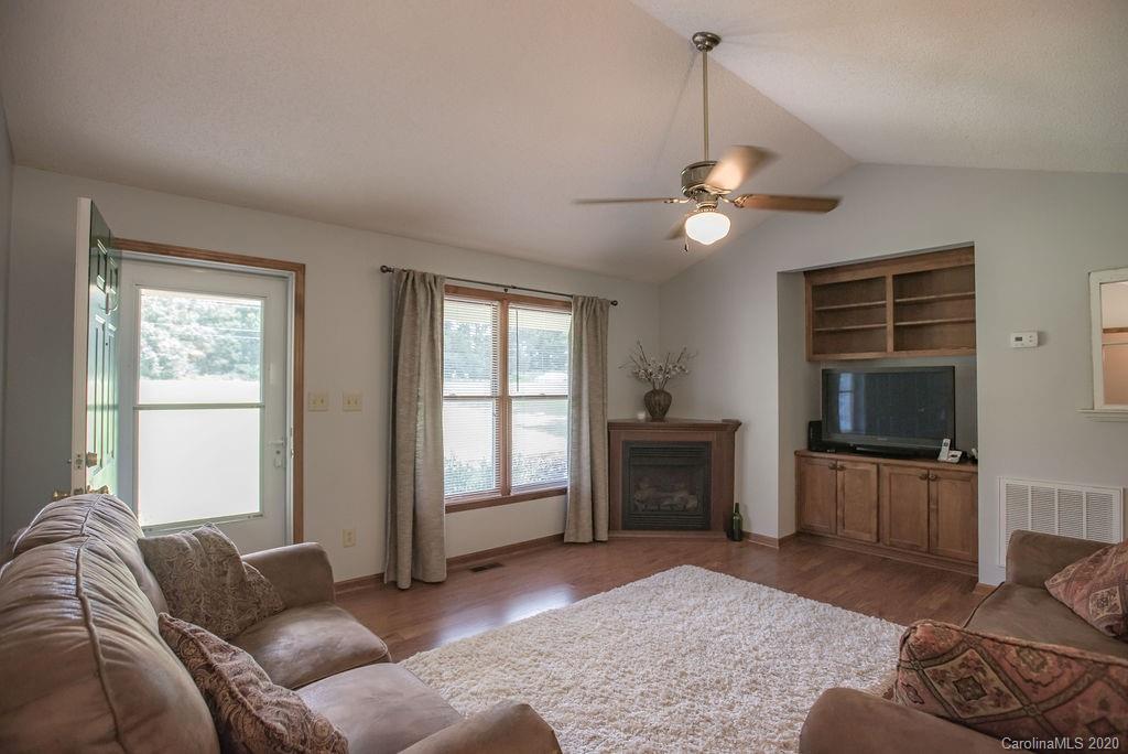 3316 Griffith Road Monroe, NC 28112 - Photo 5 of 28 a living room with furniture and a flat screen tv