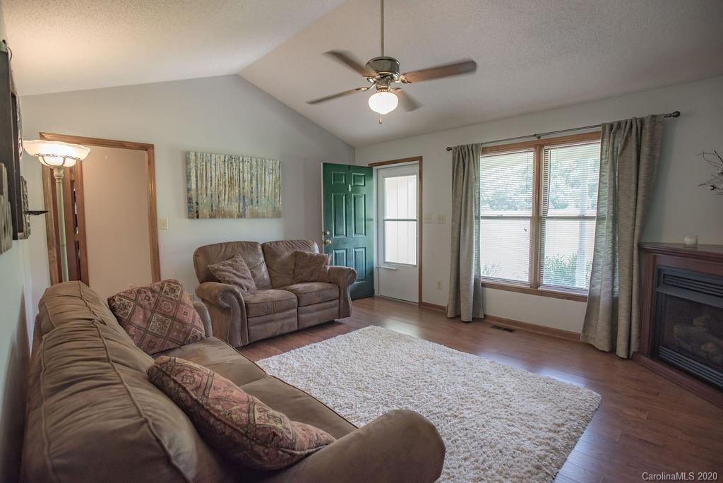 3316 Griffith Road Monroe, NC 28112 - Photo 6 of 28 a living room with furniture and a fireplace