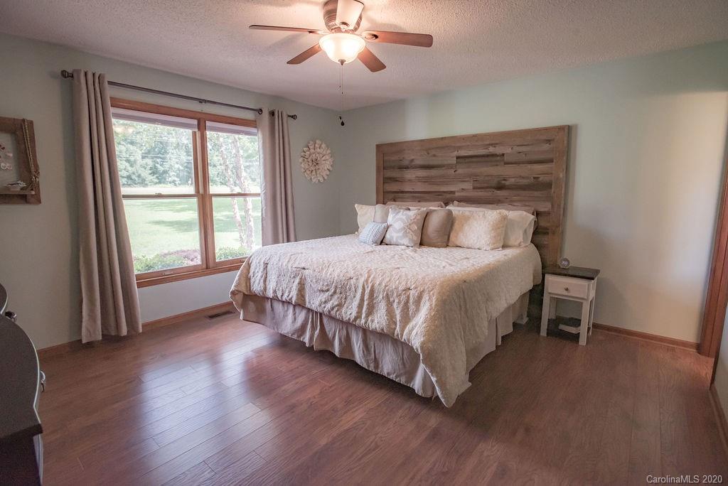 3316 Griffith Road Monroe, NC 28112 - Photo 9 of 28 a bedroom with a large bed and a large window