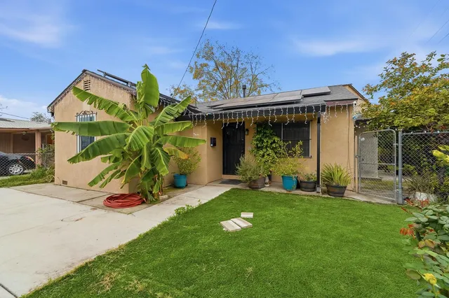 a front view of a house with garden