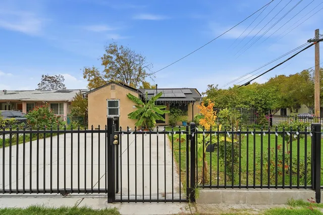 a view of a house with a small yard