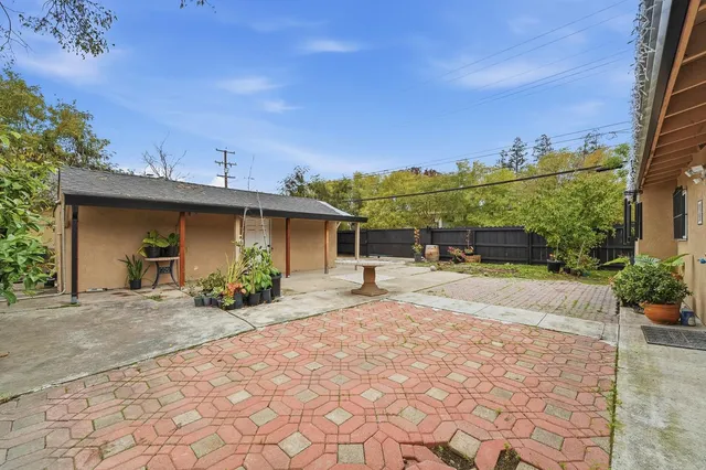 a view of a house with sitting area and furniture