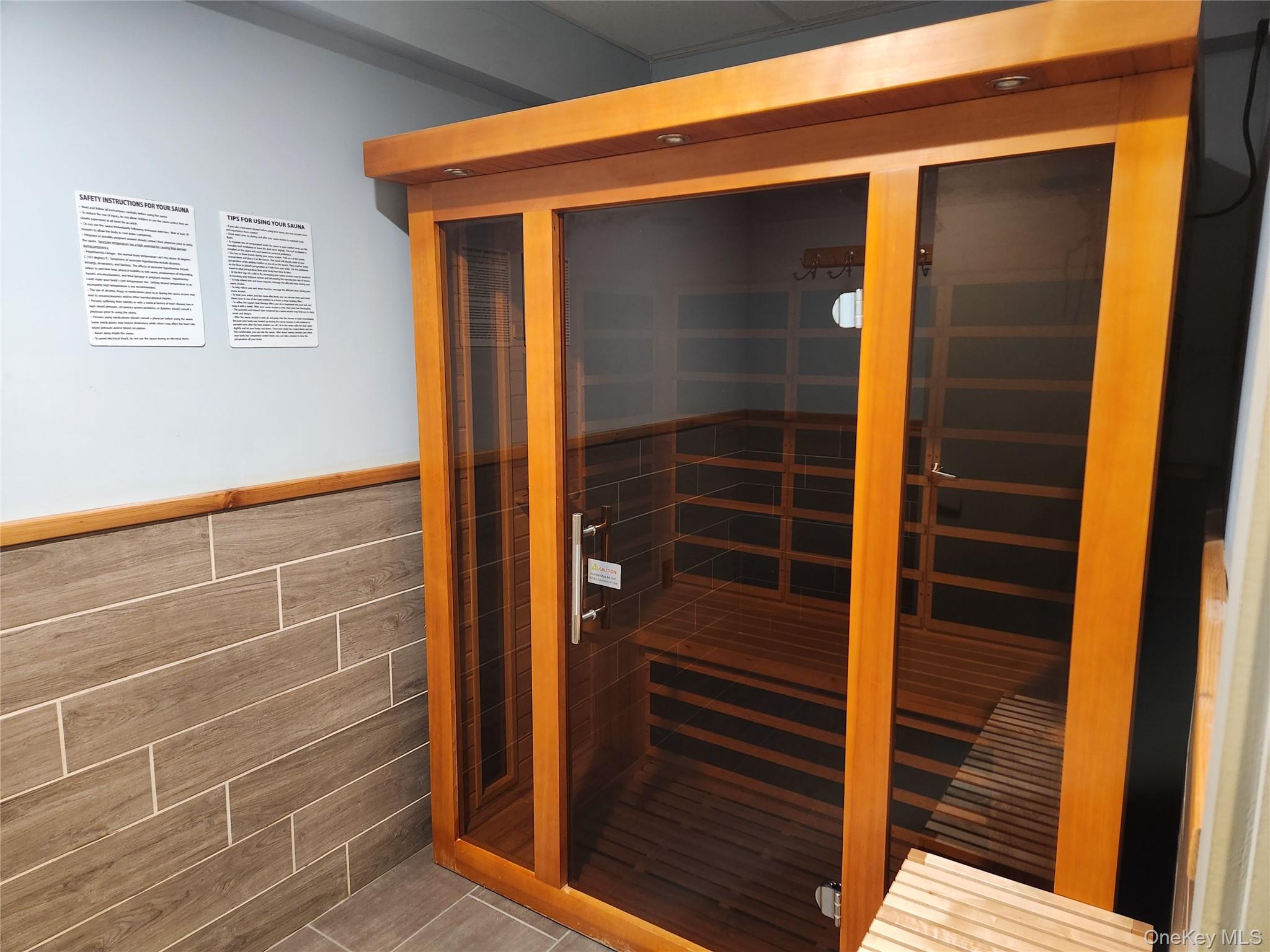 700 Shore Road, Unit 2U Long Beach, NY 11561 - Photo 17 of 24 Relaxing sauna / steam room featuring a wainscoted wall