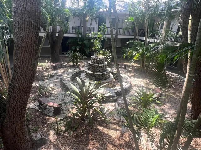 a view of backyard with trampoline