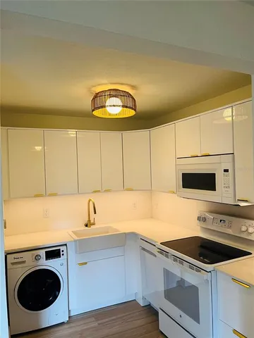 a view of a chair and table in the kitchen