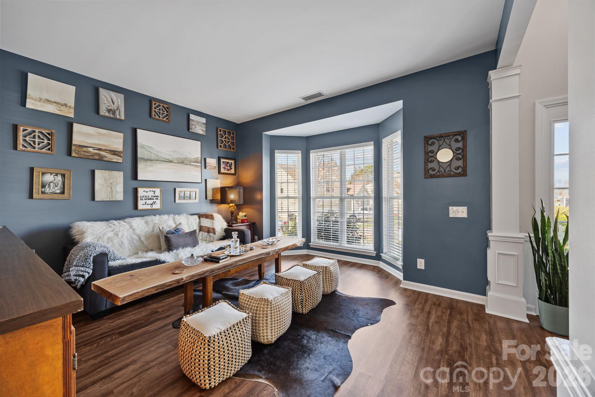 173 Coronilla Road Mooresville, NC 28117 - Photo 3 of 41 a living room with furniture and wooden floor