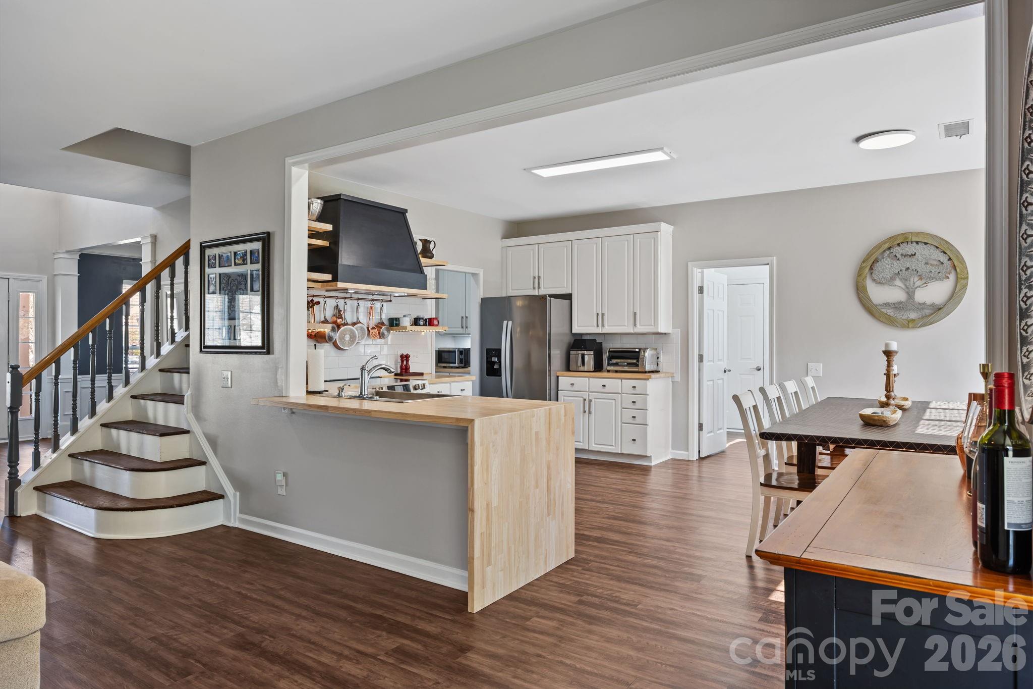 173 Coronilla Road Mooresville, NC 28117 - Photo 9 of 41 a view of kitchen with cabinets and wooden floor
