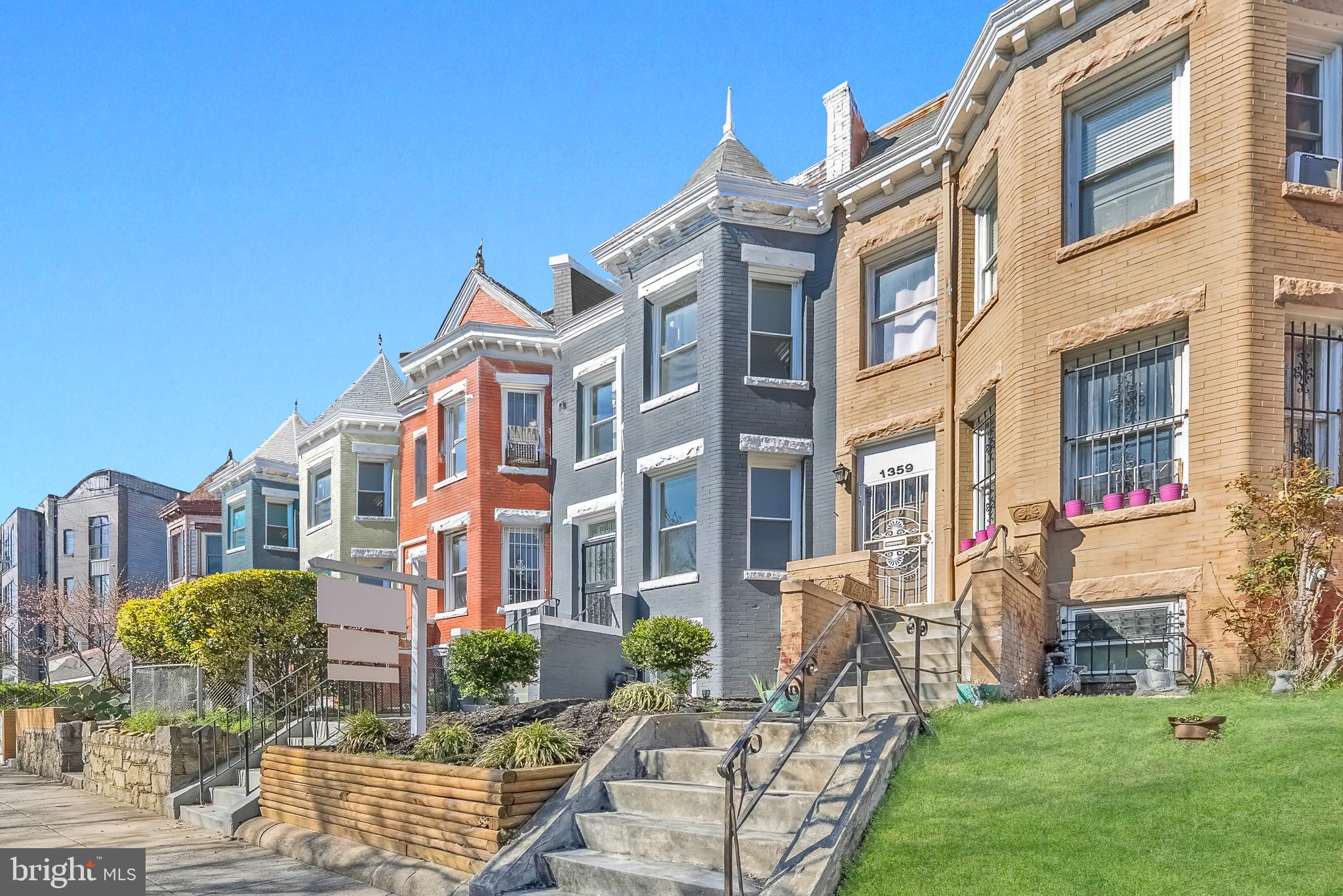 1361 Spring Road Northwest Washington, DC 20010 - Photo 1 of 40 a view of a building and a yard