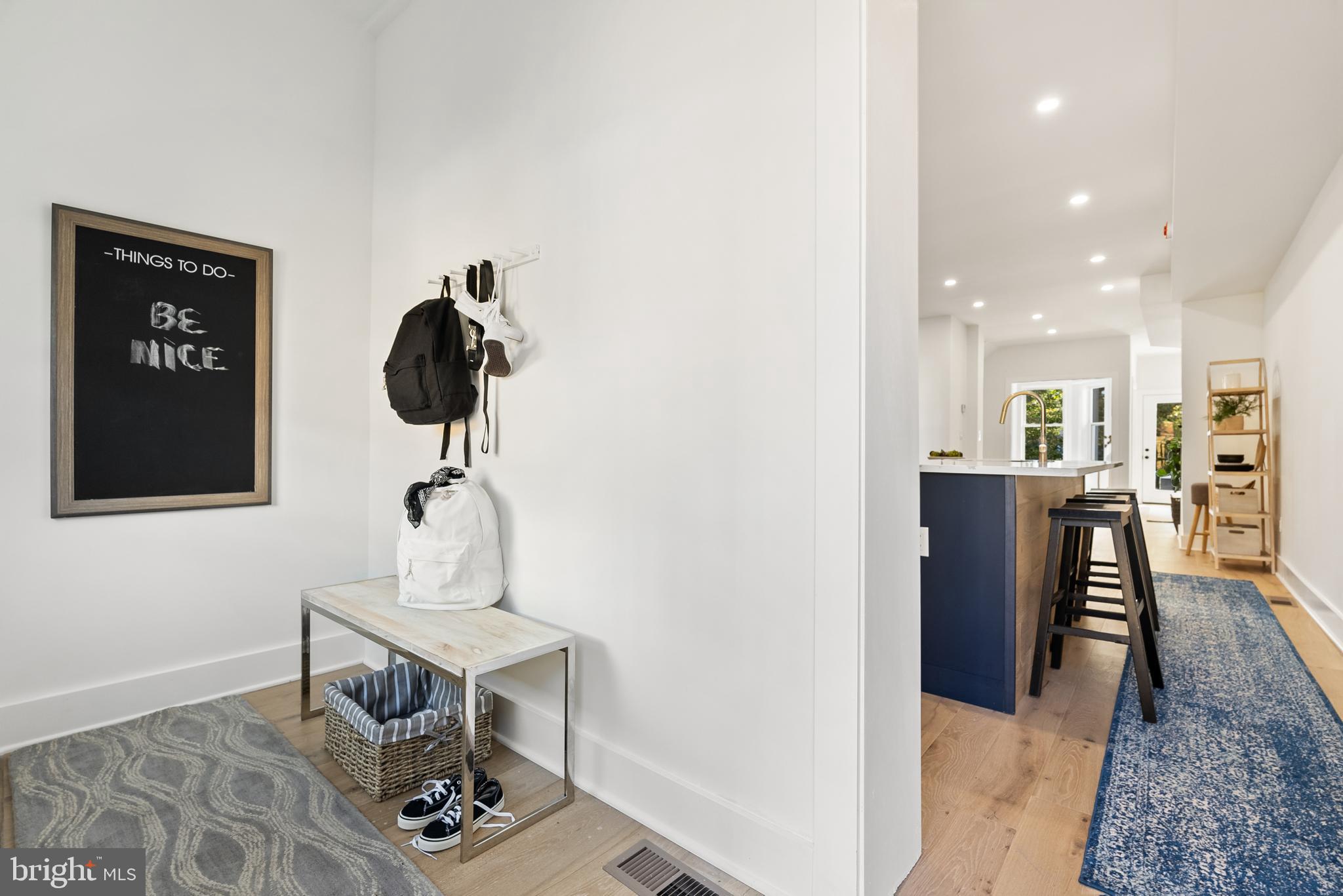 1361 Spring Road Northwest Washington, DC 20010 - Photo 14 of 40 a living room with furniture and a chandelier