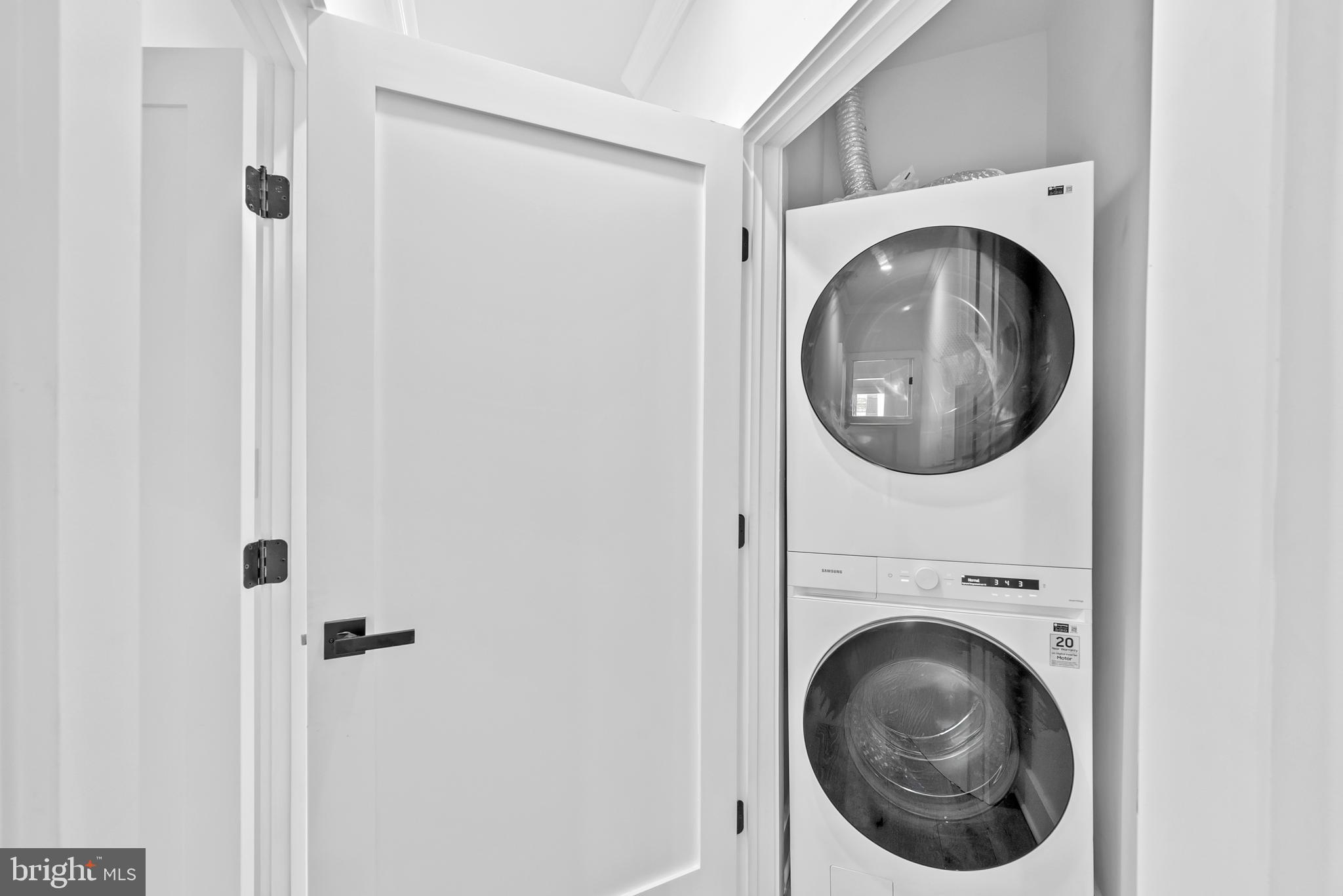 1361 Spring Road Northwest Washington, DC 20010 - Photo 20 of 40 a close up view of a washer and dryer