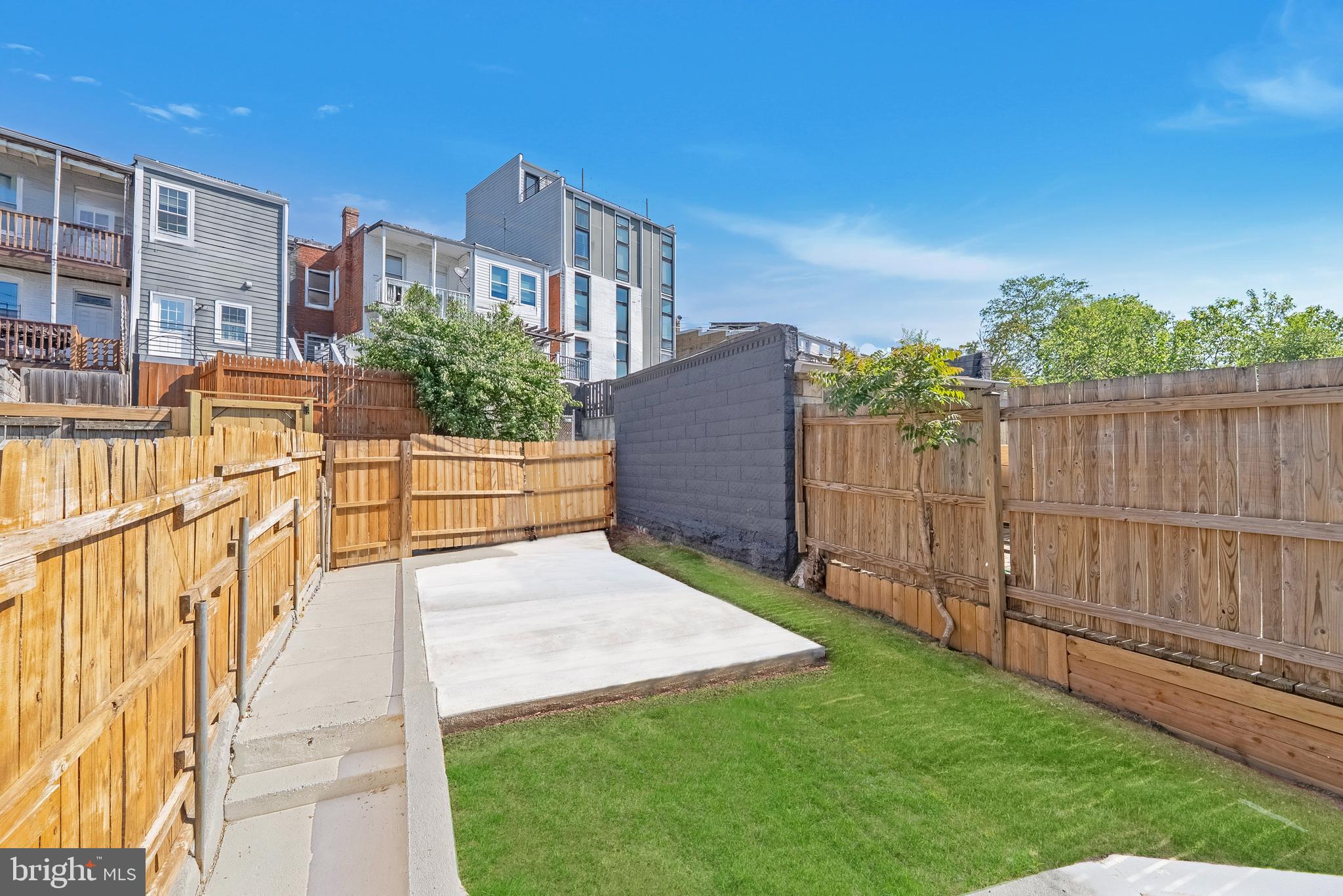 1361 Spring Road Northwest Washington, DC 20010 - Photo 33 of 40 a view of backyard with a garden and deck