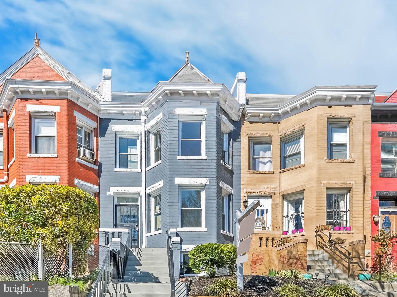 1361 Spring Road Northwest Washington, DC 20010 - Photo 38 of 40 a front view of a residential apartment building with a yard