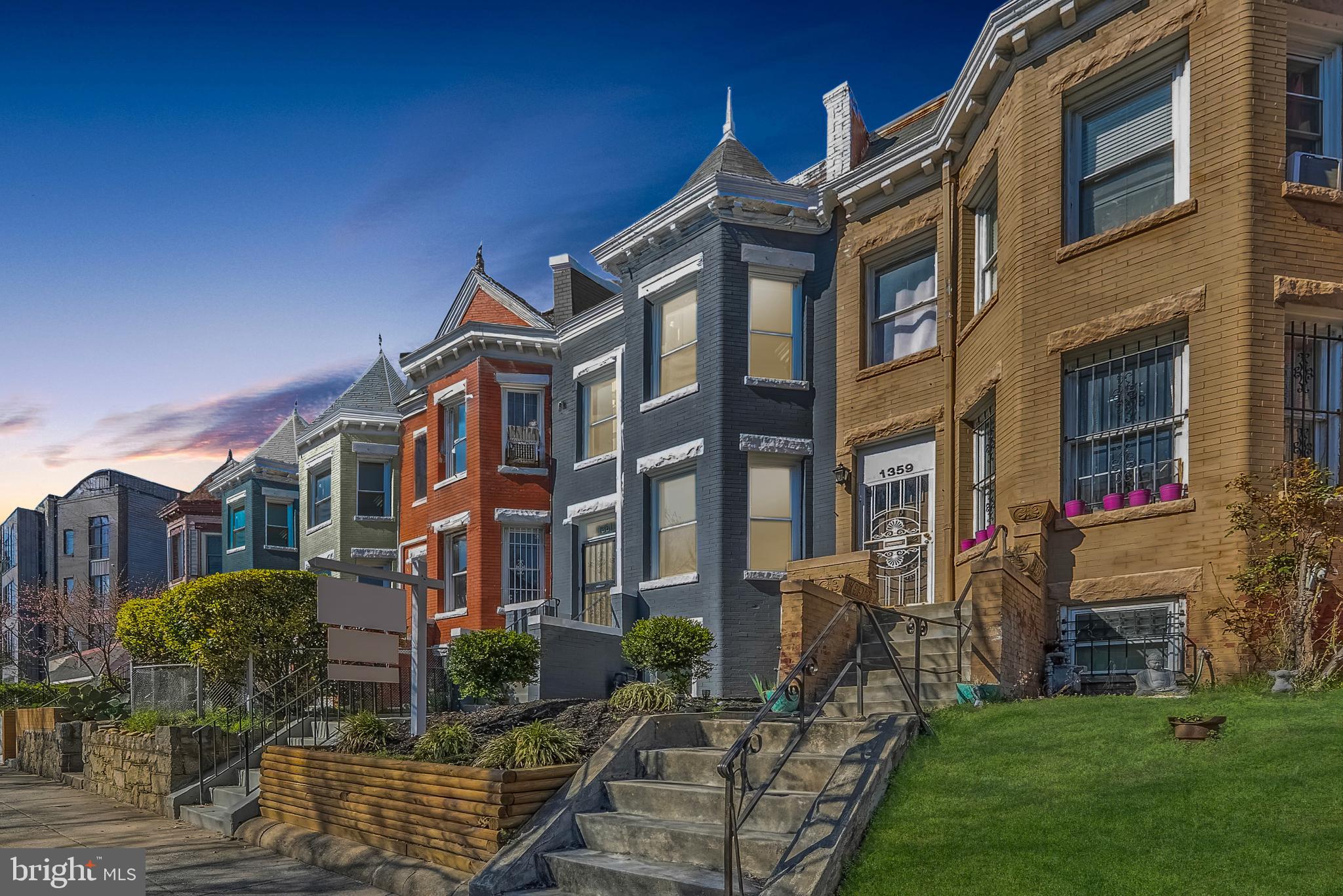 1361 Spring Road Northwest Washington, DC 20010 - Photo 39 of 40 a view of a building next to a yard