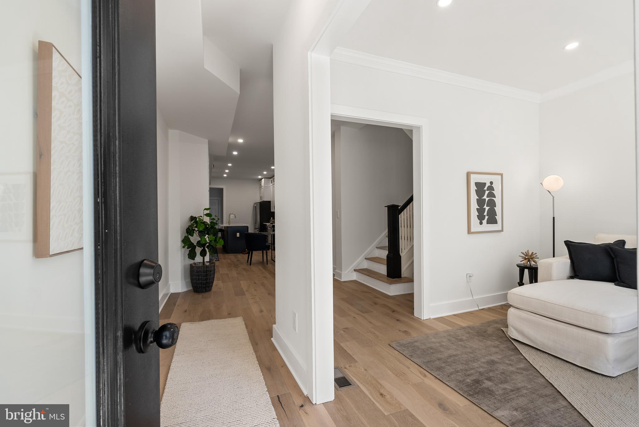 1361 Spring Road Northwest Washington, DC 20010 - Photo 3 of 40 a view of a livingroom with a furniture wooden floor and windows