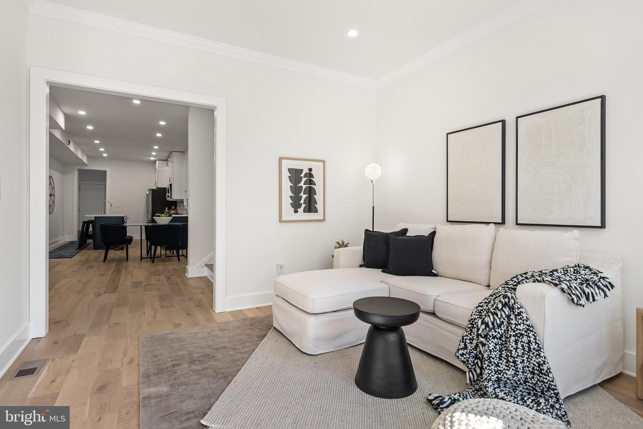 1361 Spring Road Northwest Washington, DC 20010 - Photo 6 of 40 a living room with furniture and a wooden floor