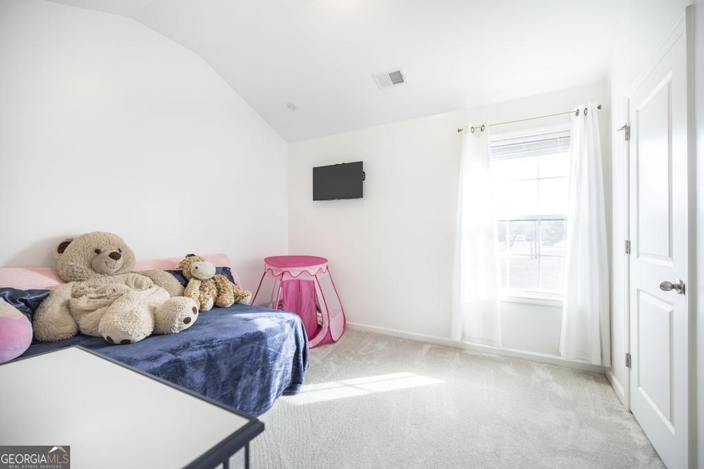 209 Adirondac Way Bonaire, GA 31005 - Photo 14 of 22 a bedroom with two beds and a window