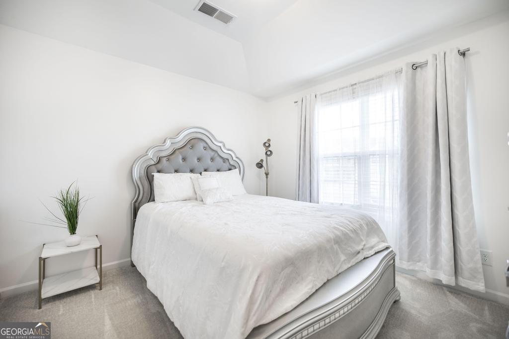 209 Adirondac Way Bonaire, GA 31005 - Photo 15 of 22 a bedroom with a bed and window