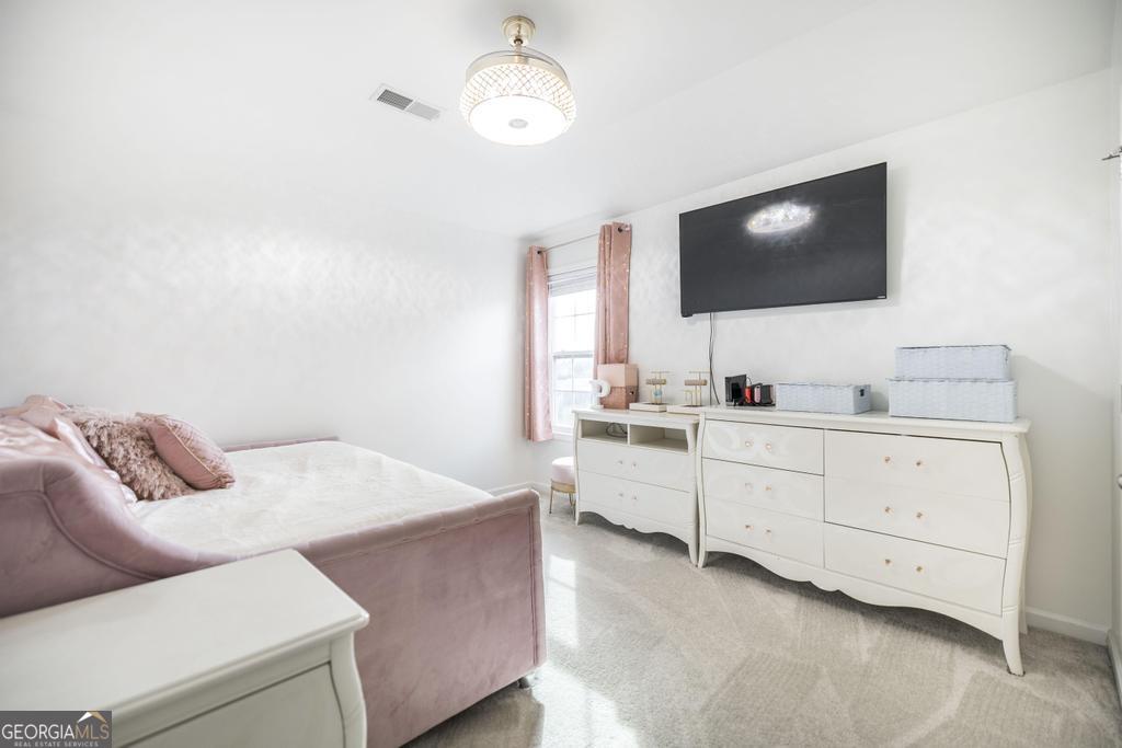 209 Adirondac Way Bonaire, GA 31005 - Photo 18 of 22 a living room with furniture and a flat screen tv