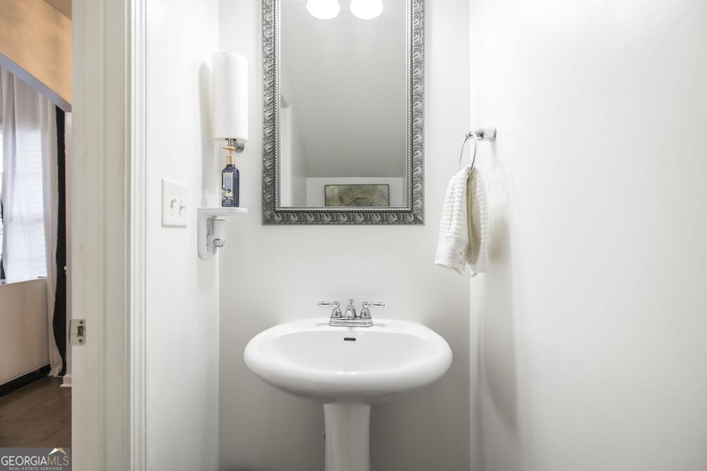 209 Adirondac Way Bonaire, GA 31005 - Photo 9 of 22 a bathroom with a sink a mirror and a shower