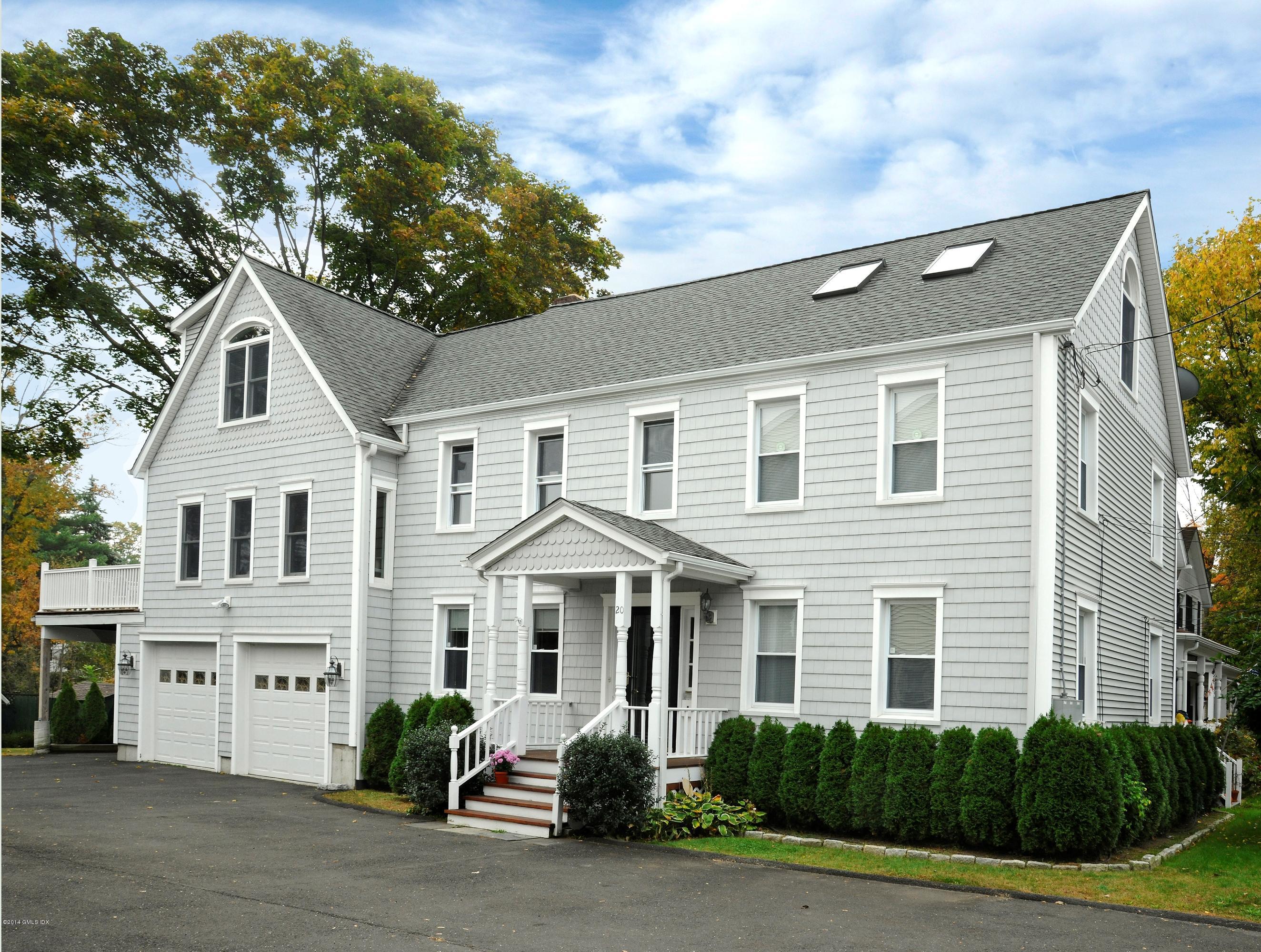 20 Division Street Greenwich, CT 06830 - Photo 1 of 19 a front view of a house with a yard