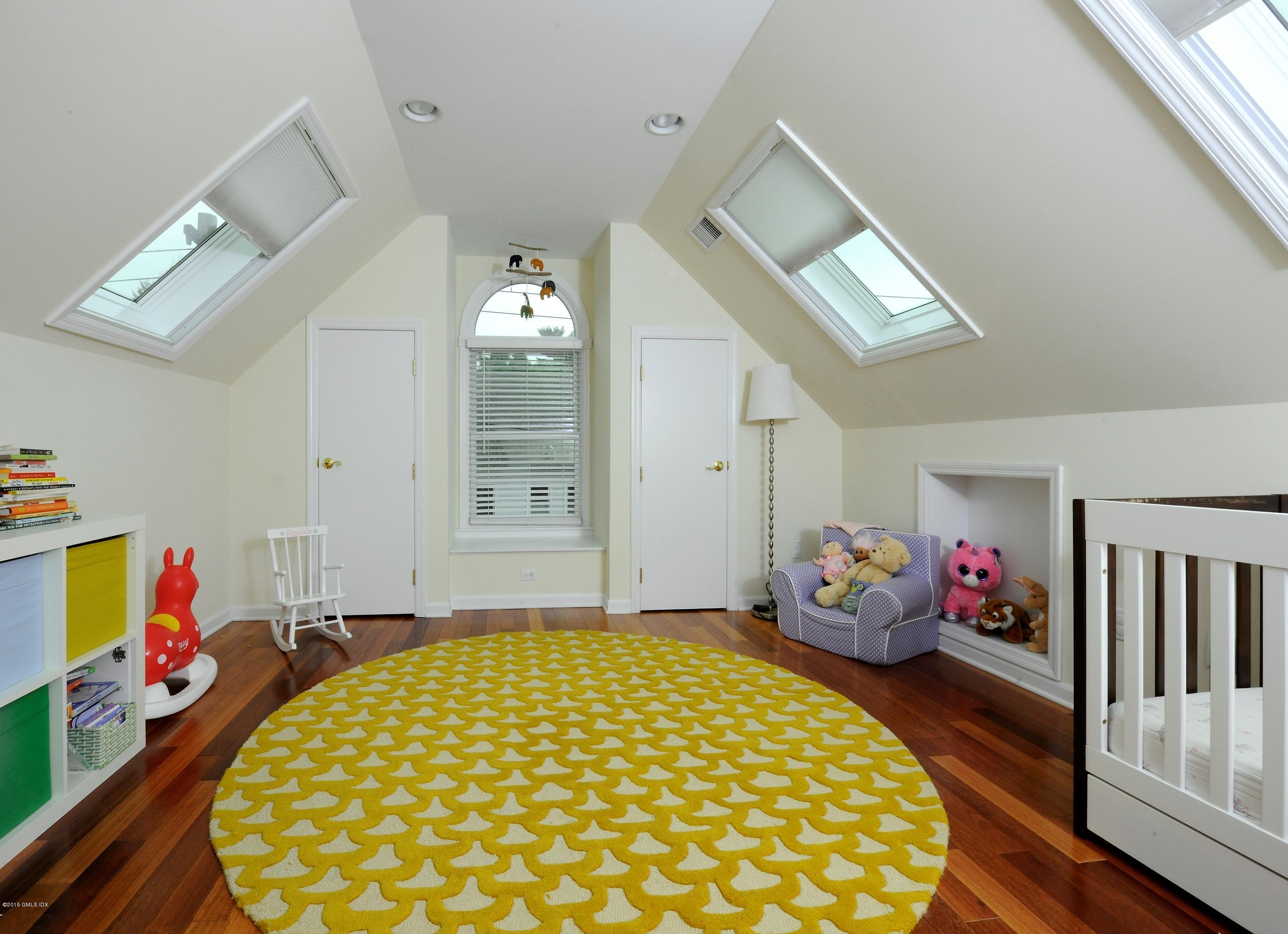 20 Division Street Greenwich, CT 06830 - Photo 11 of 19 a bedroom with bed and wooden floor