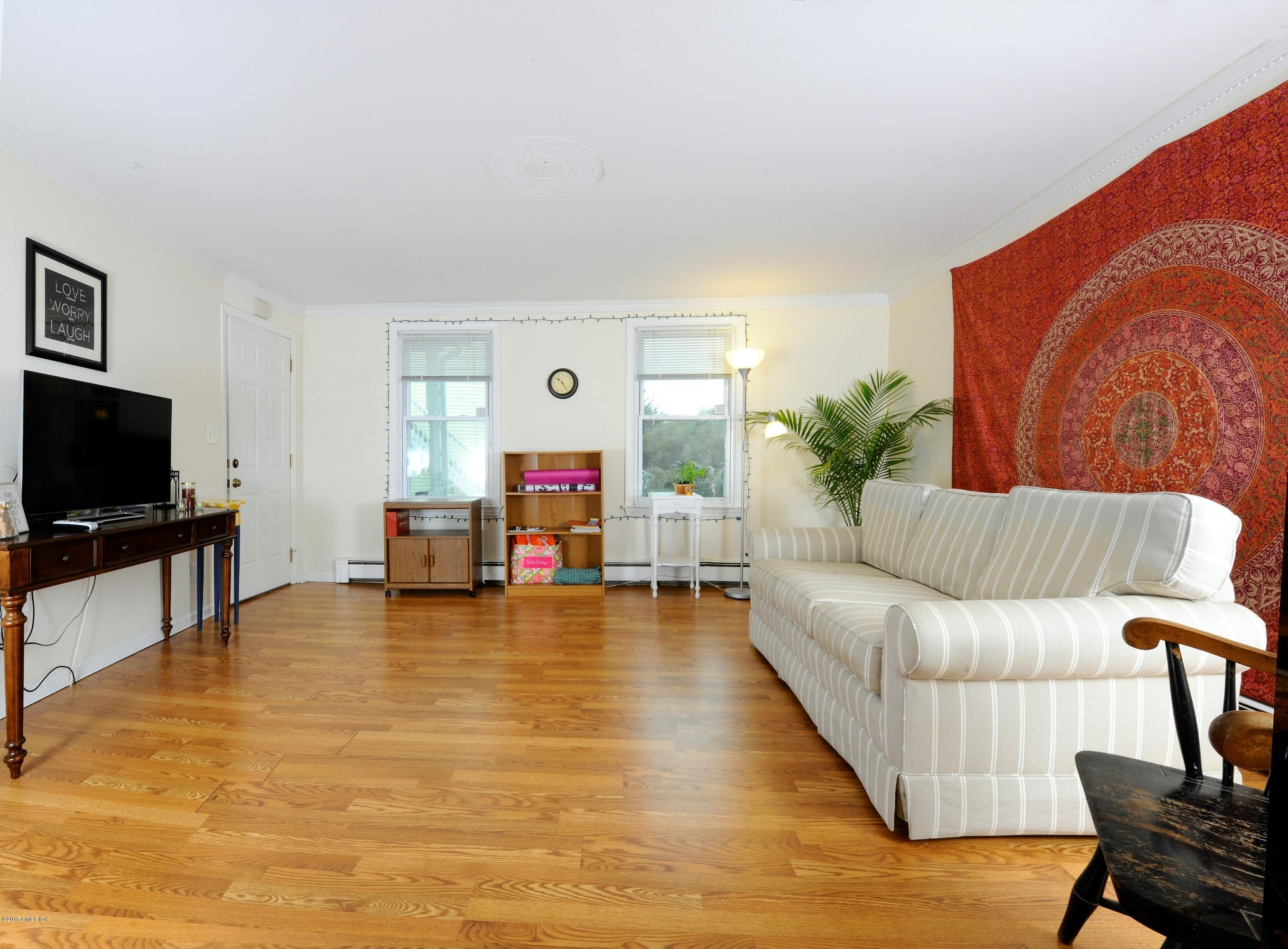 20 Division Street Greenwich, CT 06830 - Photo 14 of 19 a living room with furniture and a flat screen tv