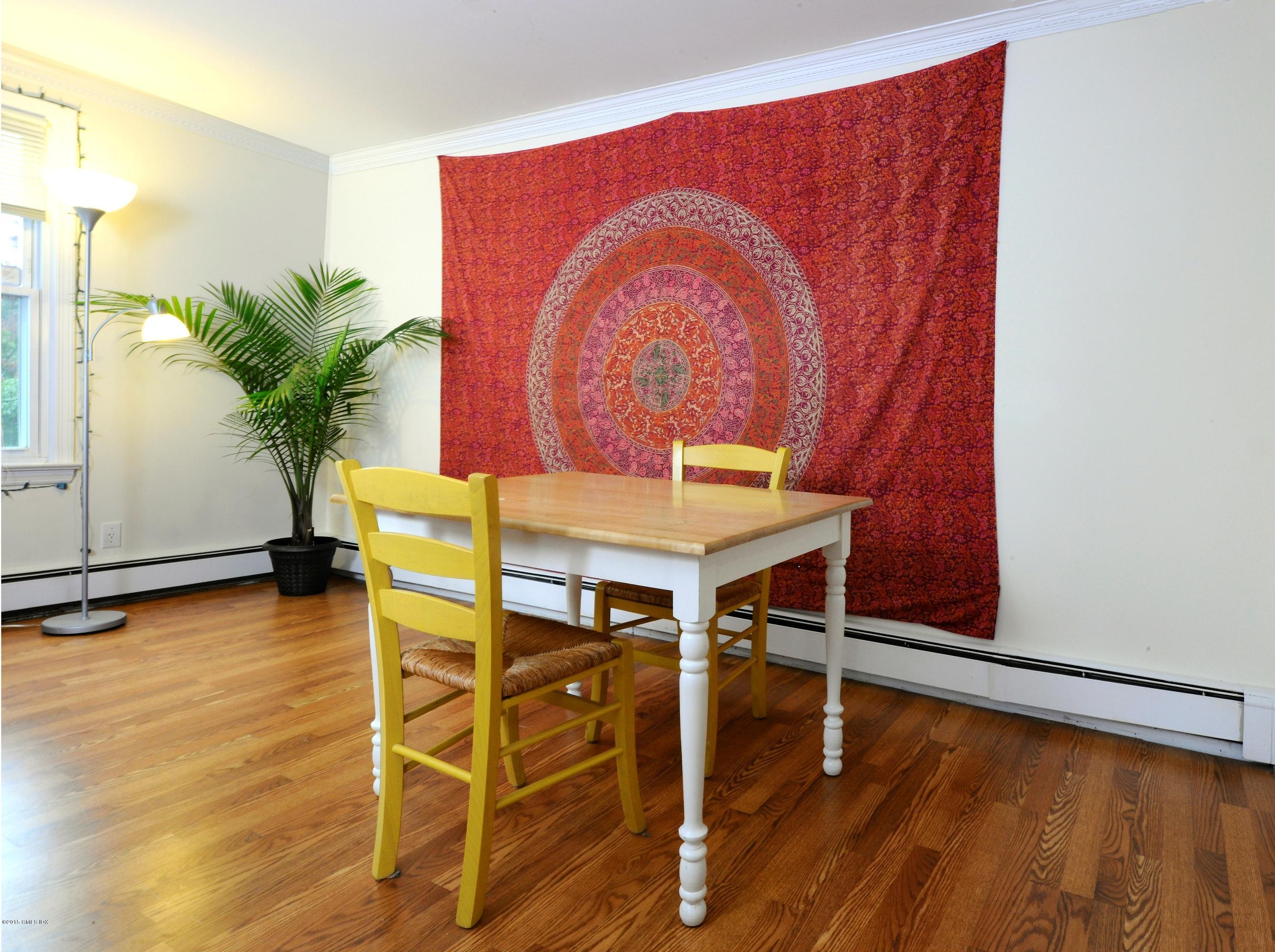 20 Division Street Greenwich, CT 06830 - Photo 15 of 19 a dining room with furniture and wooden floor
