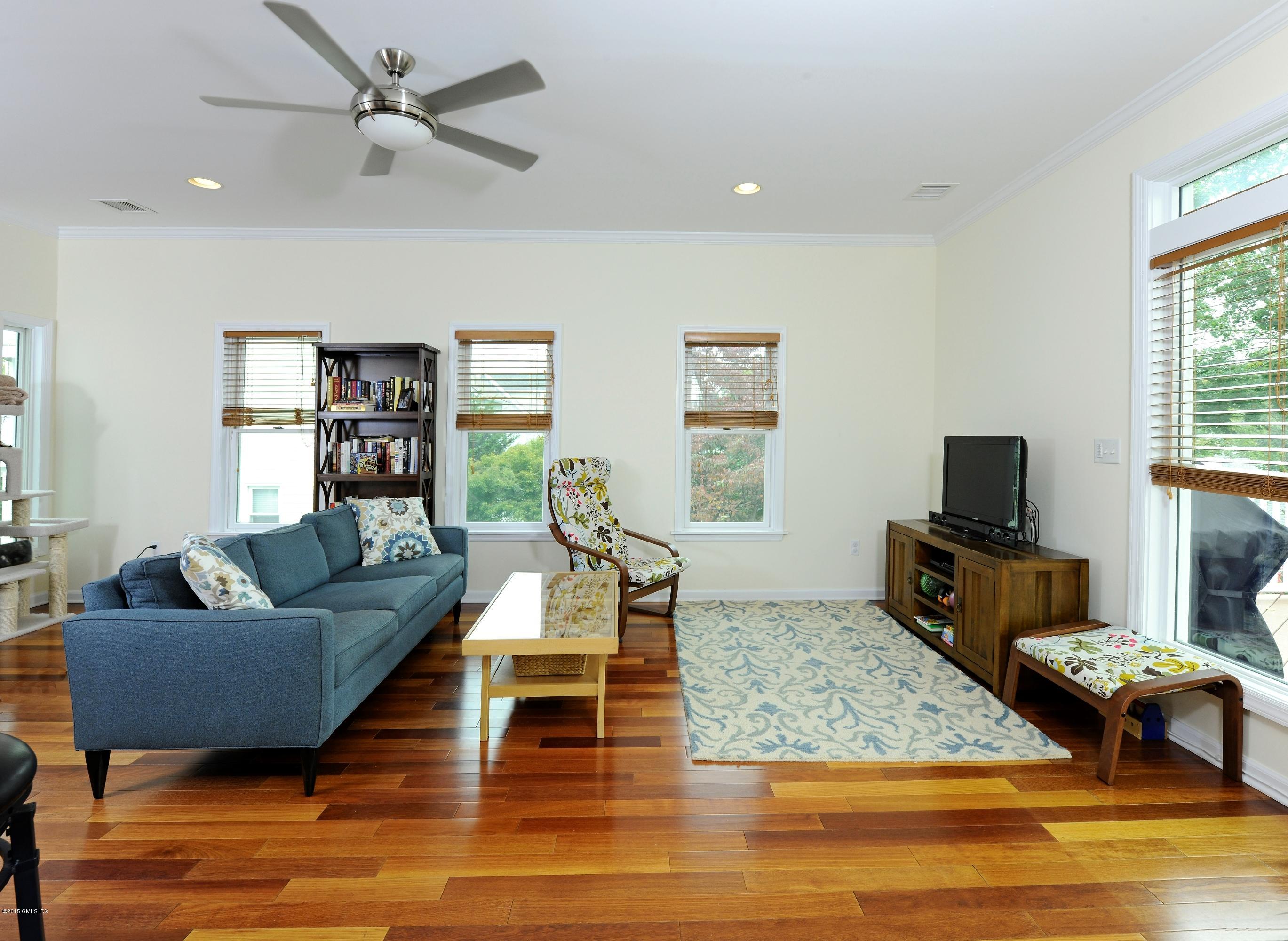 20 Division Street Greenwich, CT 06830 - Photo 2 of 19 a living room with furniture and a flat screen tv