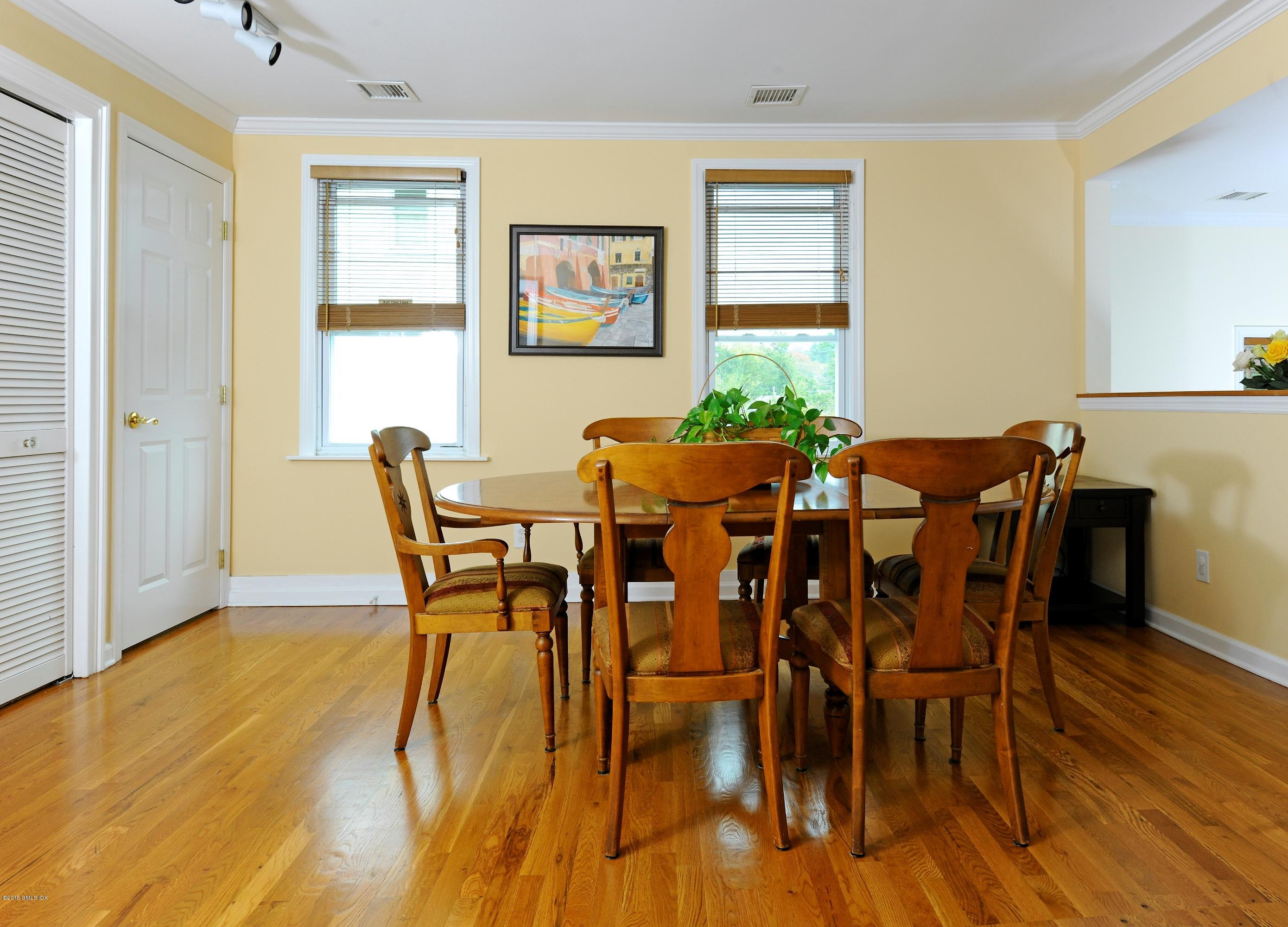20 Division Street Greenwich, CT 06830 - Photo 3 of 19 a view of a dining room with furniture and wooden floor
