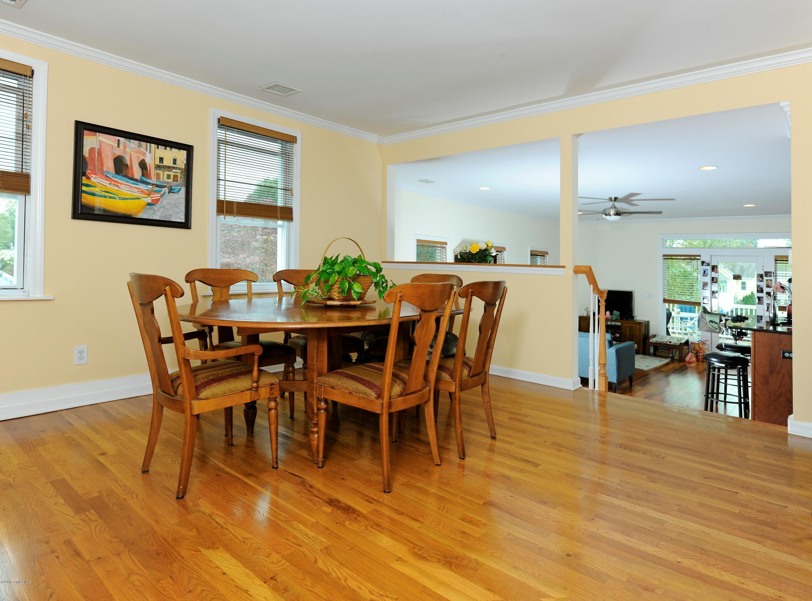 20 Division Street Greenwich, CT 06830 - Photo 4 of 19 a view of a dining room with furniture and wooden floor