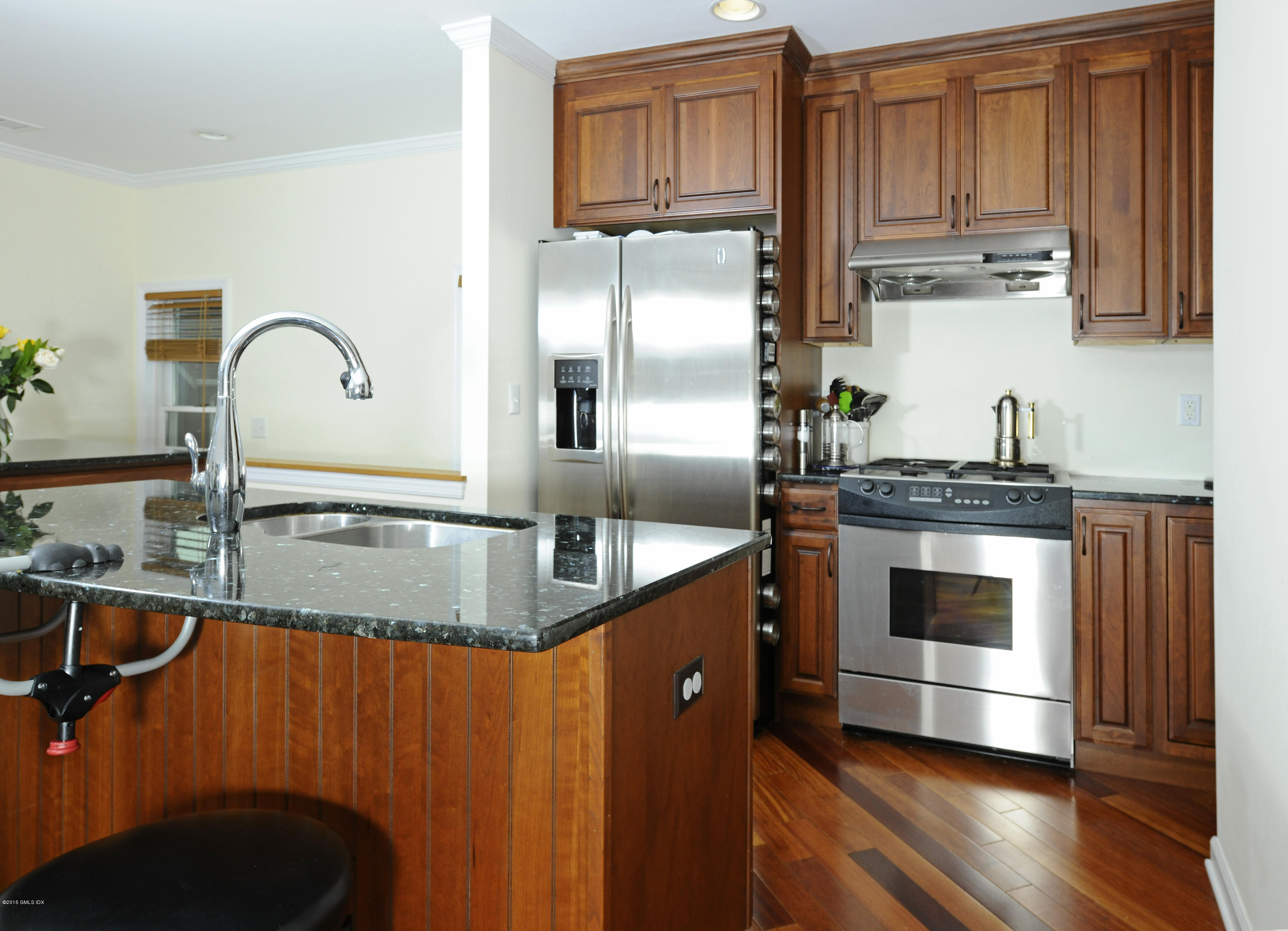20 Division Street Greenwich, CT 06830 - Photo 5 of 19 a kitchen with stainless steel appliances granite countertop a sink a stove and refrigerator