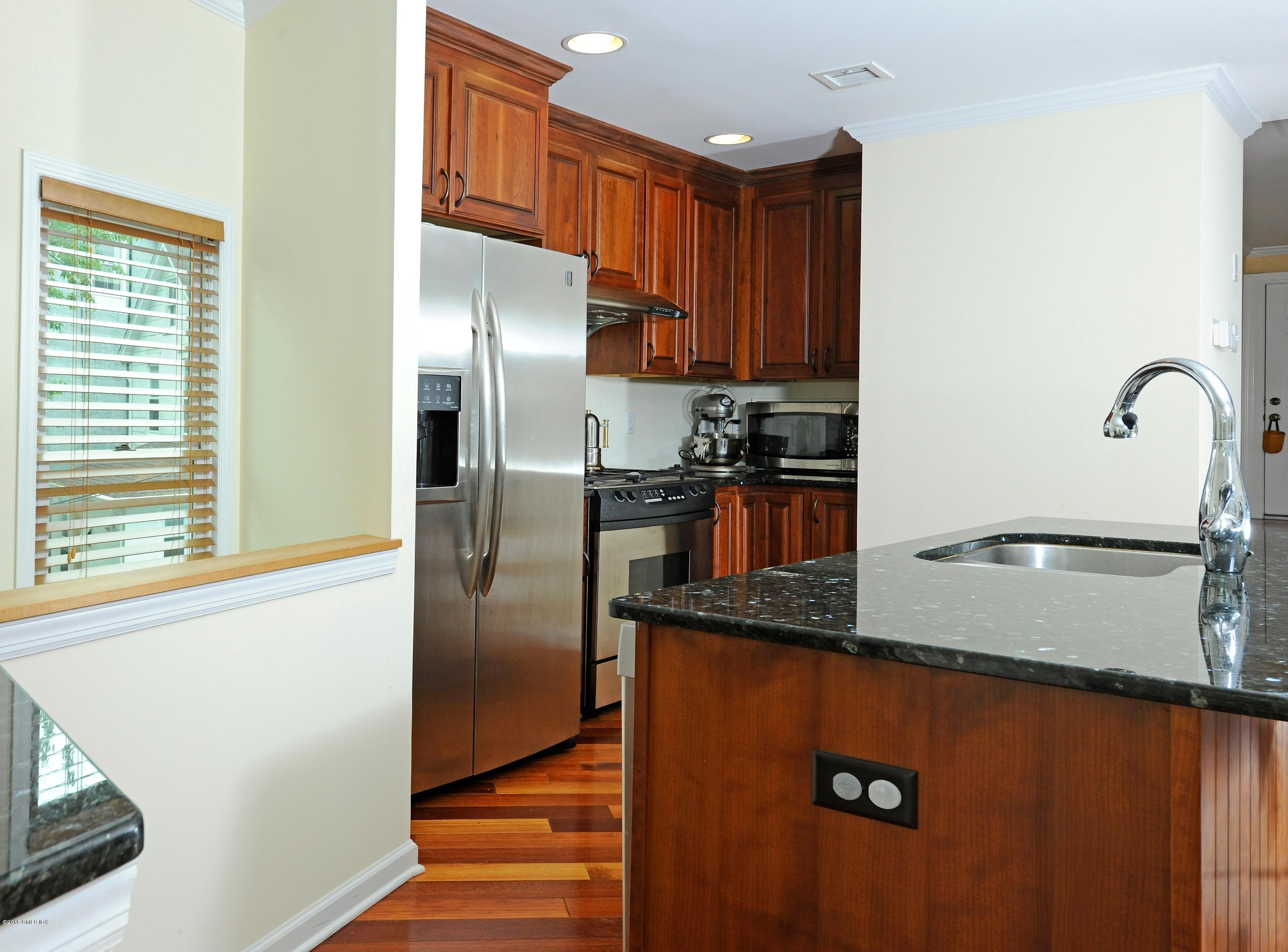 20 Division Street Greenwich, CT 06830 - Photo 6 of 19 a kitchen with granite countertop a refrigerator and a sink