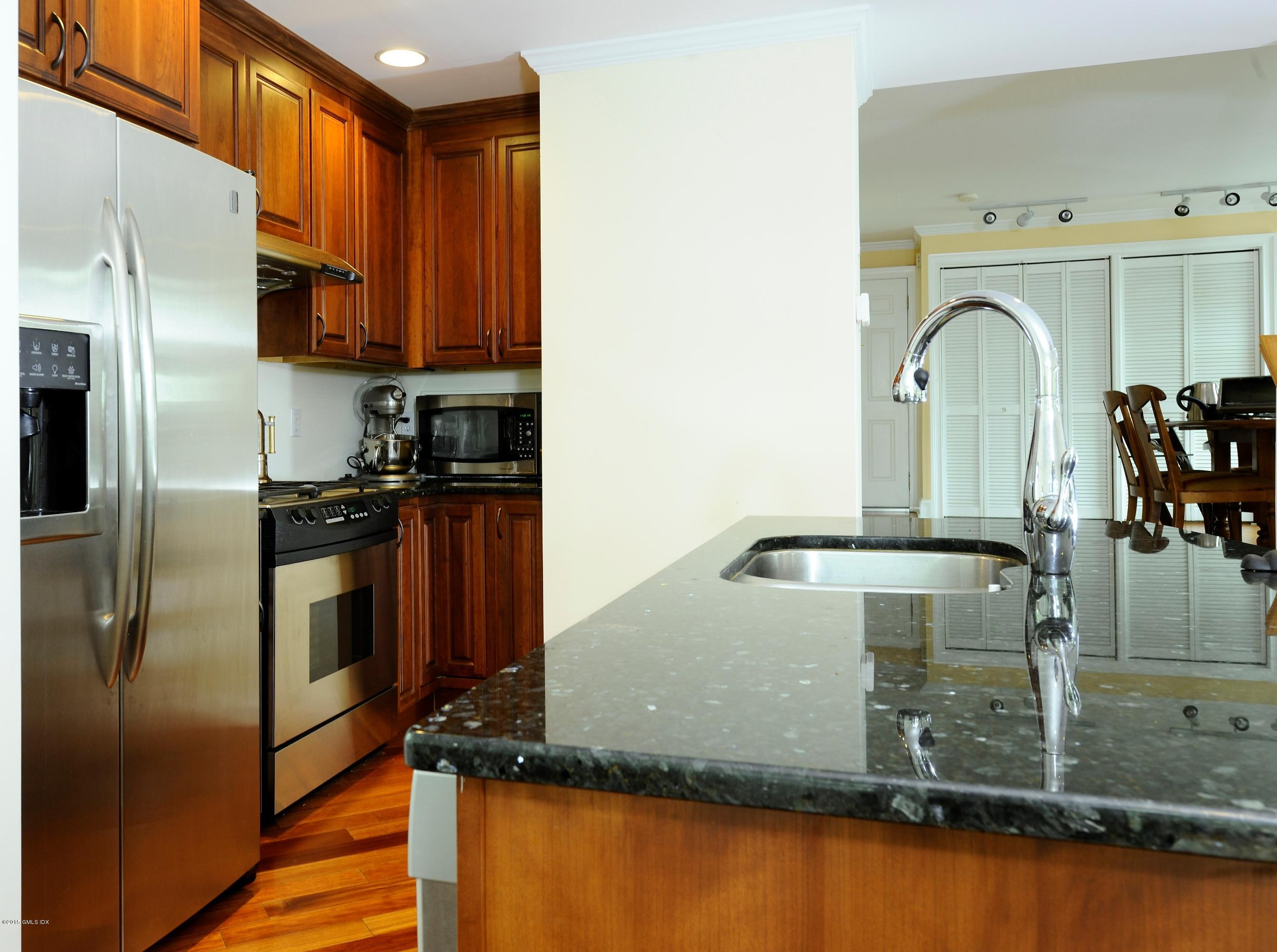 20 Division Street Greenwich, CT 06830 - Photo 7 of 19 a kitchen with a refrigerator and a sink