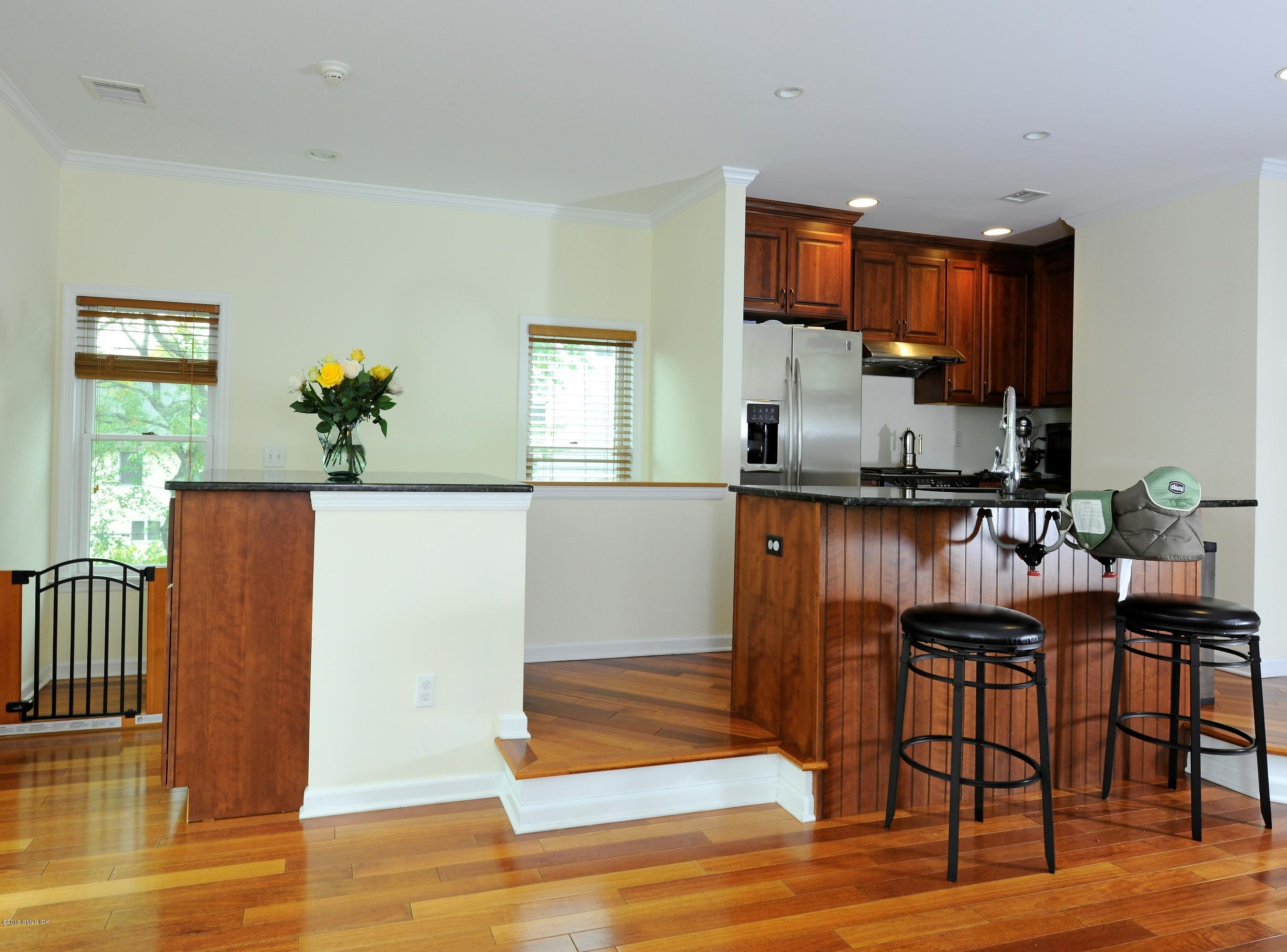 20 Division Street Greenwich, CT 06830 - Photo 8 of 19 a room with granite countertop furniture and a wooden floor