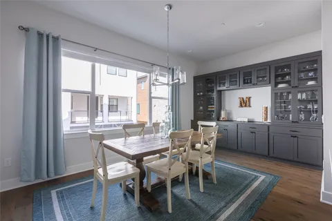 a dining room with furniture window wooden floor