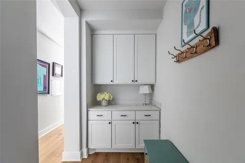 a kitchen with cabinets and a window