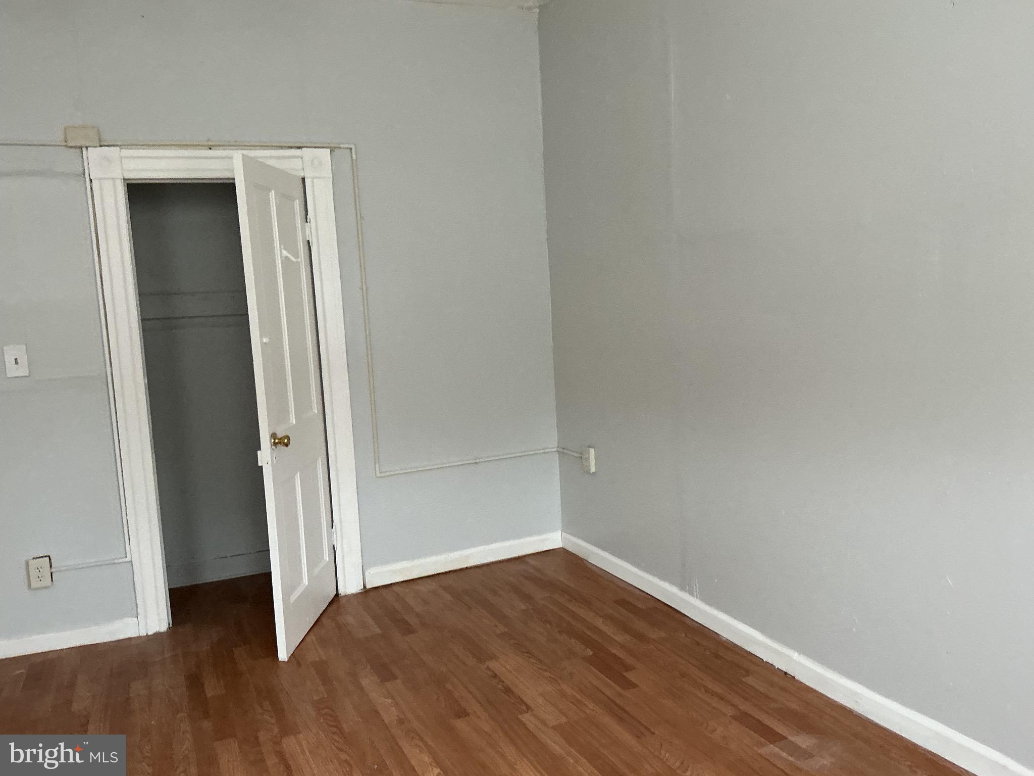 5010 Belair Road Baltimore, MD 21206 - Photo 20 of 24 an empty room with wooden floor and closet