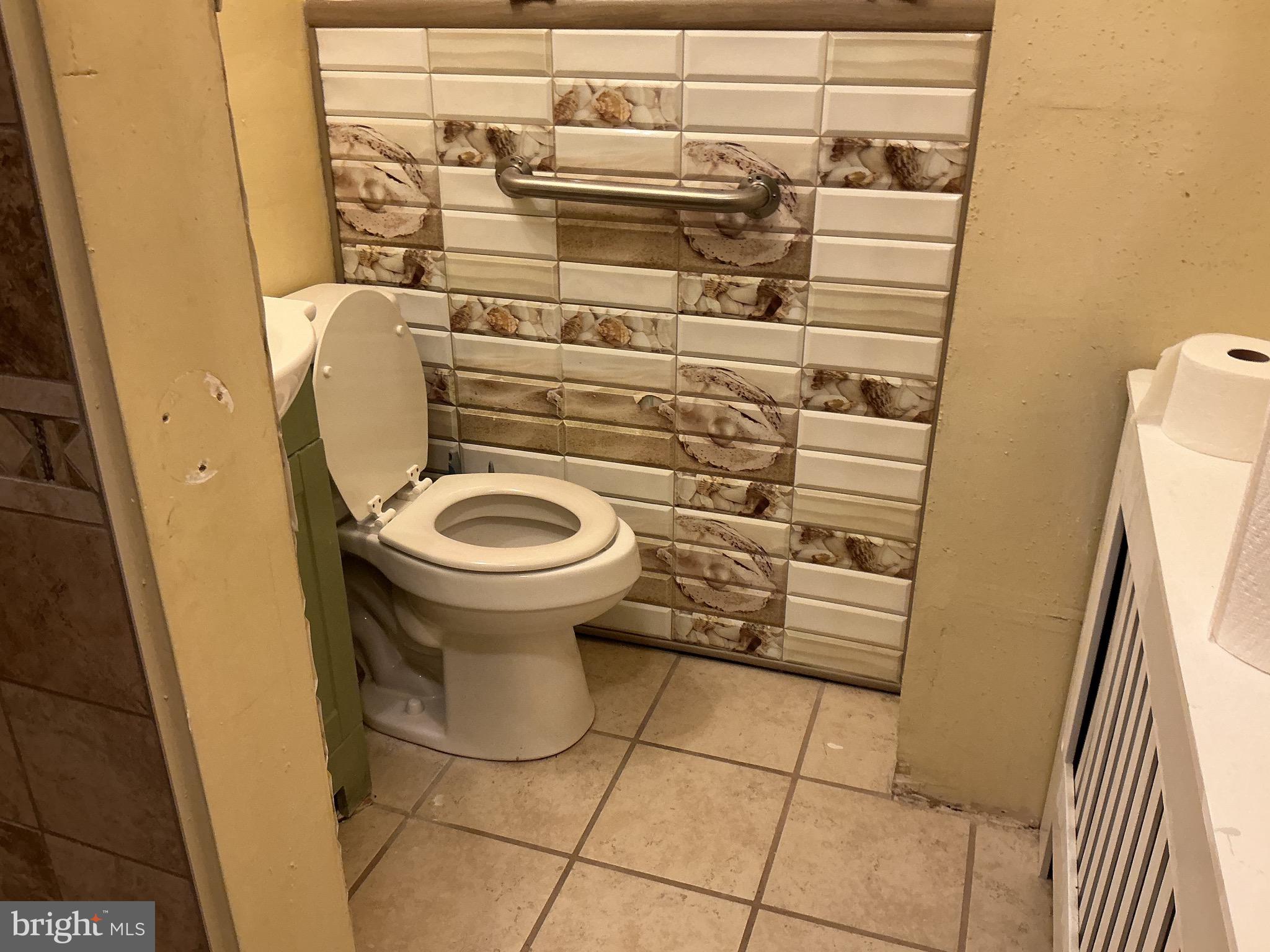 5010 Belair Road Baltimore, MD 21206 - Photo 23 of 24 a bathroom with a sink and toilet