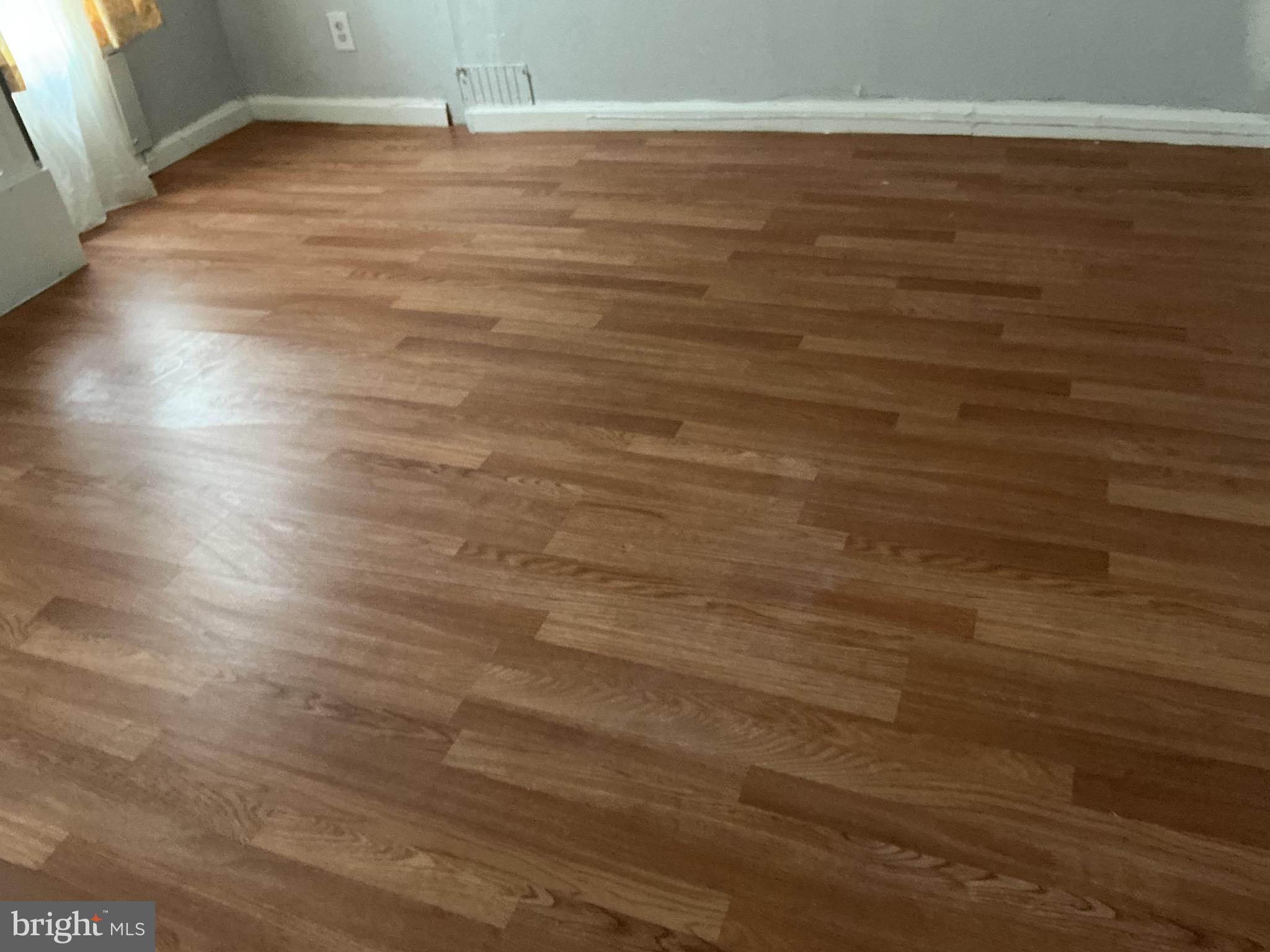 5010 Belair Road Baltimore, MD 21206 - Photo 24 of 24 a view of a room with an empty space and wooden floor