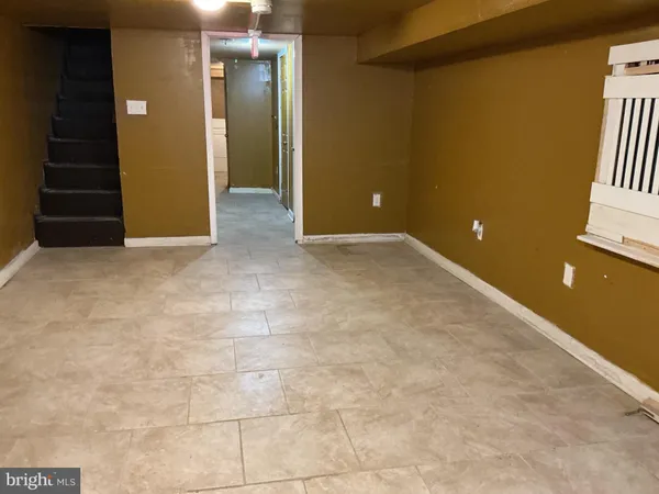 a view of an empty room with windows